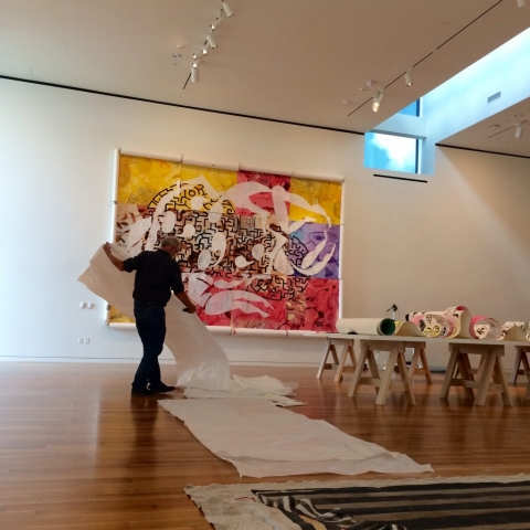 Columbus Museum of Art Exhibition Designer Greg Jones installs Bodies@Work: The Art of Ruben and Isabel Toledo.