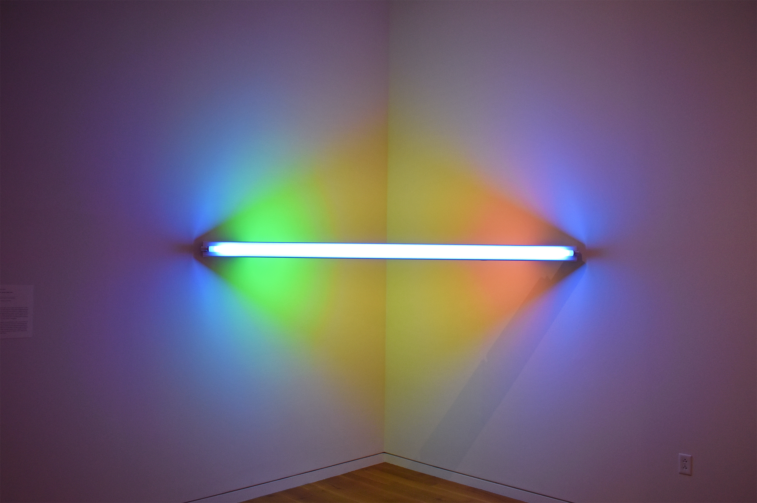 Dan Flavin, Untitled (to Janie Lee) one, 1971. Blue, pink, yellow, and green fluorescent light. Gift of Mr. and Mrs. William King Westwater